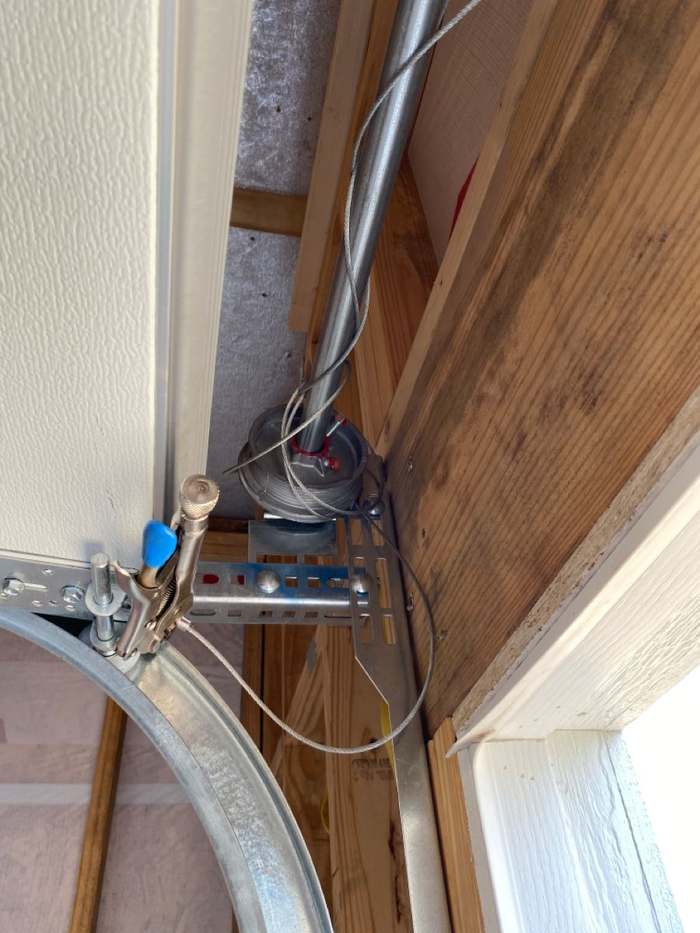 Garage door lifting cable off its drum