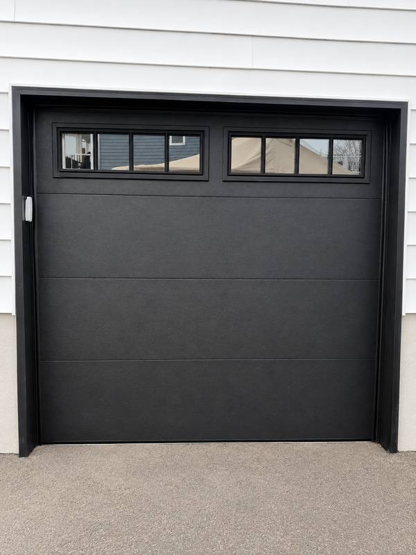 Black flush garage door with windows