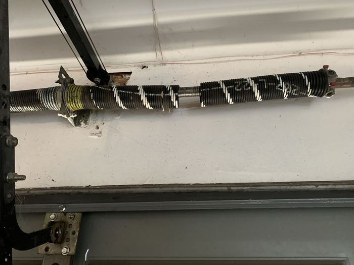 Broken garage door torsion spring